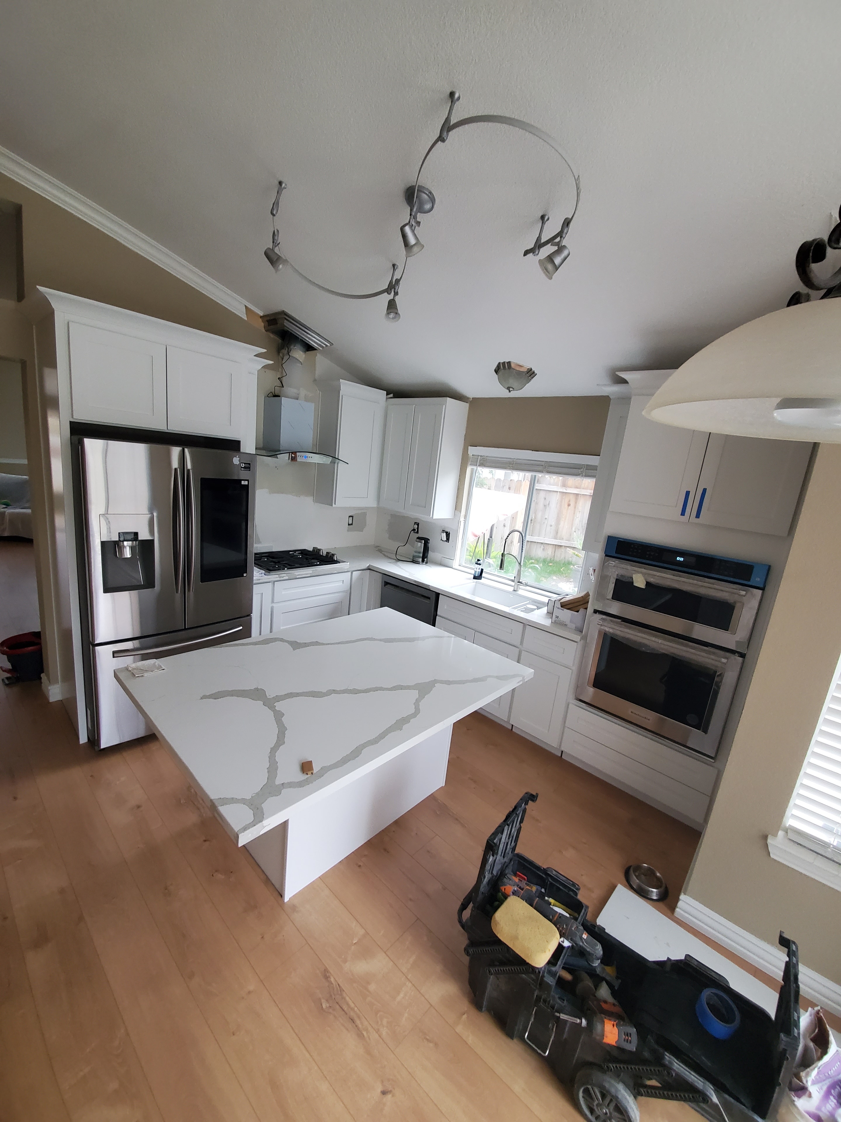 Modern kitchen with white cabinets and island