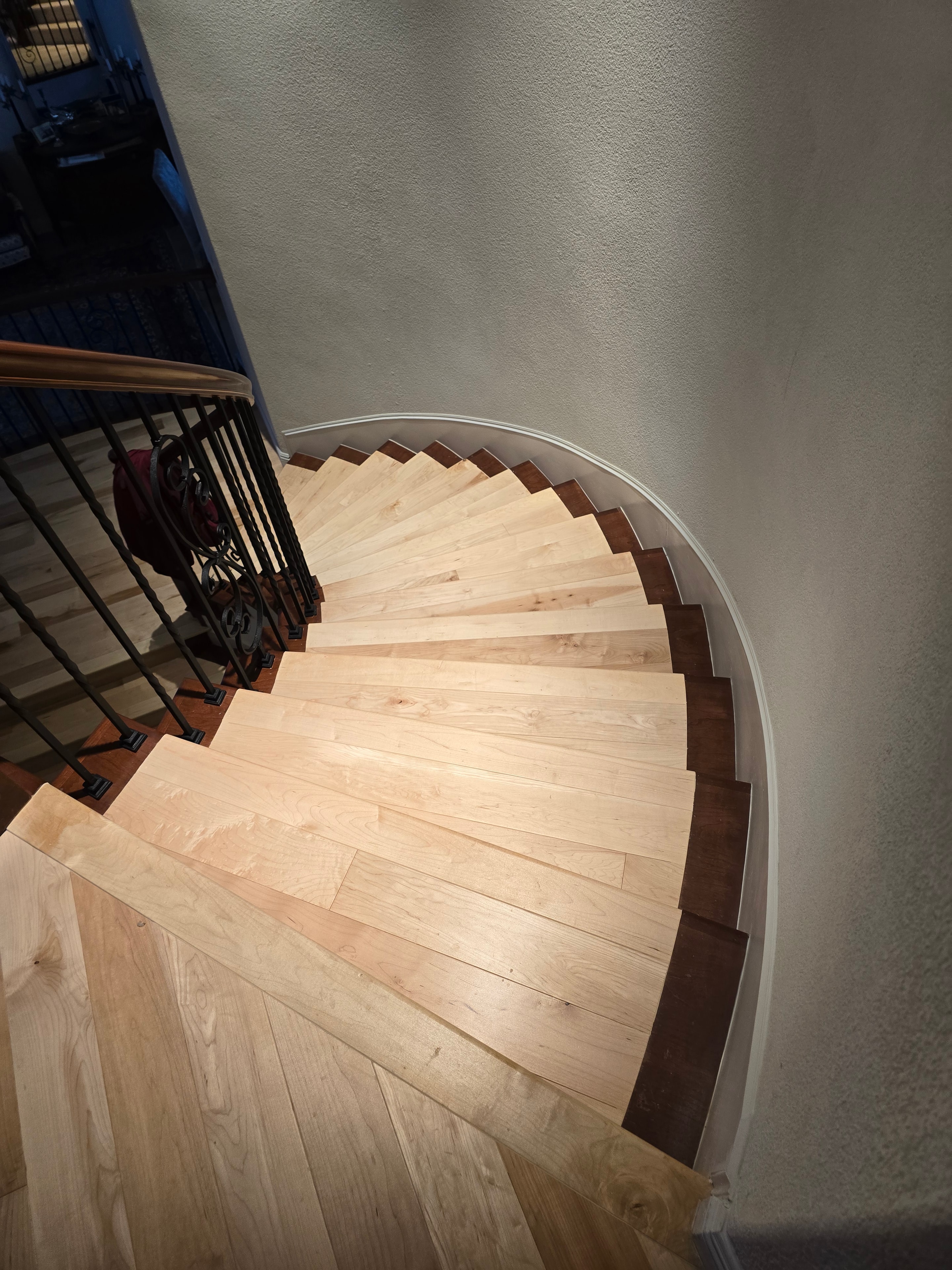 Spiral staircase with hardwood flooring installation